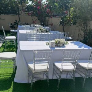 8 ft Tables and clear chairs