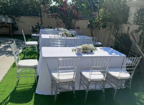 8 ft Tables and clear chairs